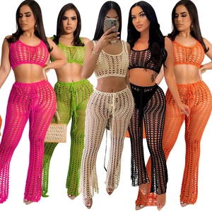Detail of five colors of crochet openwork beach sets with halter tops and flared pants