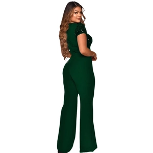 Detailed view of dark green wide leg jumpsuit with shimmering sequined short sleeves