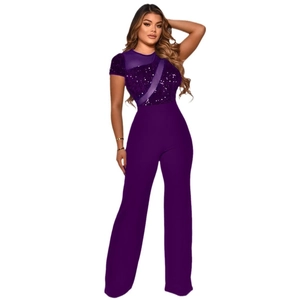 Detail of purple sequin stitching and sheer mesh texture on the sleeveless jumpsuit