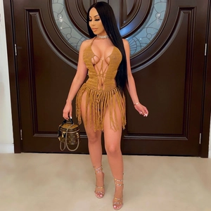 Brown crochet knit monokini featuring halter neck design and long bohemian fringe tassels
