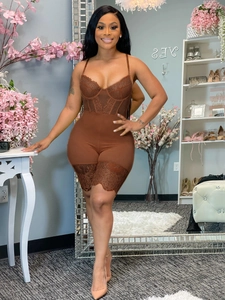 Detailed view of brown lace teddy bodysuit with delicate scalloped edges on a model