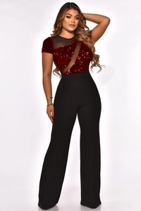 Detail of red sequins and black mesh patchwork on short sleeve wide leg jumpsuit