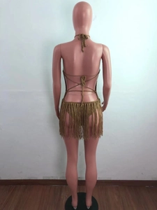 Back view of bohemian khaki crochet beach set with long tassels on a mannequin