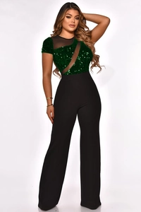 Detail of sequin short sleeve top with mesh splice and black wide leg trousers