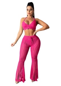 Detail of rose pink crochet two-piece set featuring hollow-out knit and flared beach pants