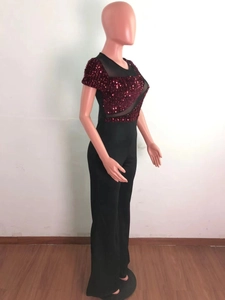 Detail of burgundy sequin splicing and black mesh fabric on short sleeve jumpsuit