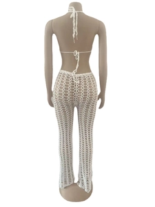 Detailed back view of white crochet cutout beach set with halter neck and mesh texture