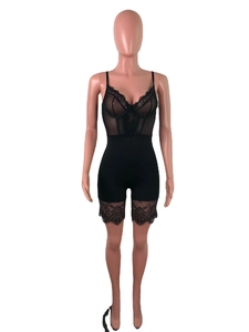 Close-up of black lace bodysuit with adjustable straps and intricate mesh detailing