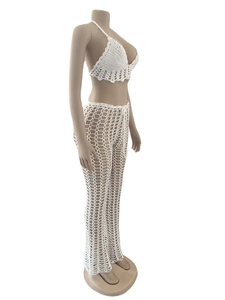 Detailed side view of white crochet mesh set featuring halter top and wavy hem detail