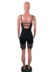 Detailed back view of black bodysuit with adjustable straps and delicate lace trim