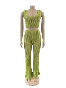 Detail of green hollow-out crochet knit set with mesh texture and drawstring waist