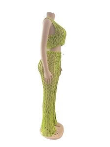 Detail of green crochet two-piece set featuring open-knit mesh texture and drawstring waist