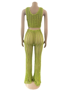 Detail view of lime green crochet knit mesh fabric with handmade hollow-out wave edge pattern