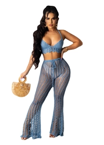 Close-up of blue crochet knit hollow out crop top and high waist flare pants set