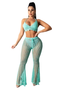 Detail showing the intricate mint green crochet knit texture and scalloped hem on the top