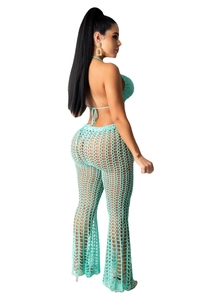 Detail of turquoise crochet knit halter top and hollow out mesh pants set for beachwear