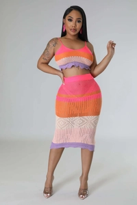 Detailed close-up of multi-color striped crochet knit texture on a beach set