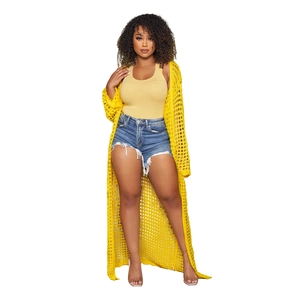 Detail view of the yellow crochet long cardigan and denim shorts three-piece set