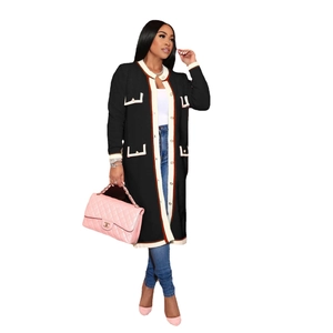 Long black knit cardigan with contrasting piping, four pockets, and metal buttons