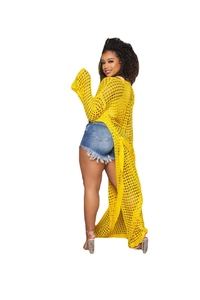 Macro detail of vibrant yellow crochet knit cardigan with hollow breathable pattern