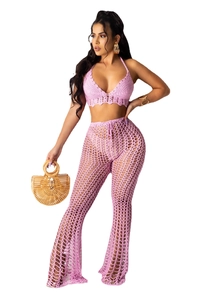 Detailed view of pink crochet two-piece set featuring hollow knit pattern and boho style
