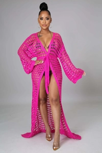 Detail of rose red crochet knit beach cover-up with bell sleeves and drawstring waist