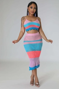 Detail of colorful knit crochet two-piece set featuring vibrant stripes and wave edges