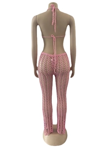 Detail of pink crochet halter top and hollow out mesh pants from a back view