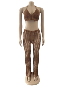 Detailed crochet texture of brown two-piece beach set featuring intricate hollow mesh patterns