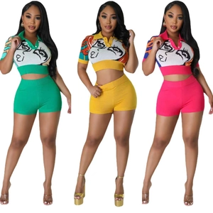 Women's two-piece knit set with abstract face print short top and high waist shorts