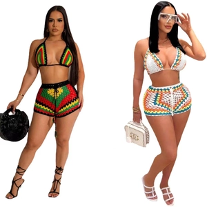 Close-up of bohemian crochet bikini set with halter top and high-waisted drawstring shorts