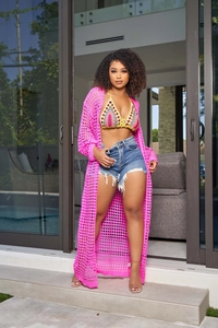 Close-up of pink hollow-out mesh knit cardigan and colorful crochet bikini on a model
