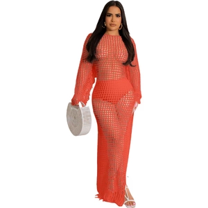 Chic orange hollow crochet maxi dress with long sleeves and stylish tassel hem details