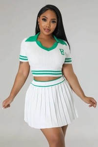 Detail of green striped rib-knit trim and letter B embroidery on white two-piece set