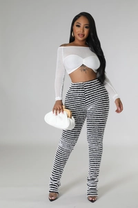 Detail of high waisted striped flared pants with soft brushed texture for women
