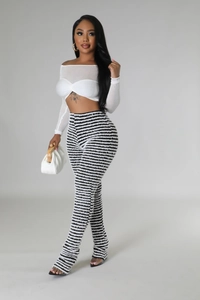 Women's chic two-piece set featuring a white twisted crop top and striped flare trousers