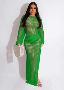 Detail of lime green hollow crochet knit maxi dress with fringe and long sleeves