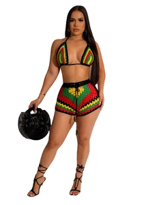 Detail of bohemian crochet two-piece set featuring Rasta color block knit patterns