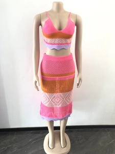 Close-up of bohemian crochet knit set with vibrant multi-color patchwork and wavy edges