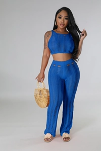 Detail showing royal blue knit texture with openwork patterns and trendy cutout details