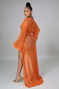 Detailed knit texture of orange hollow out crochet cover up with diamond pattern