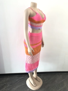 Close-up of multicolor crochet knit beach set with hollow-out pattern and vibrant stripes