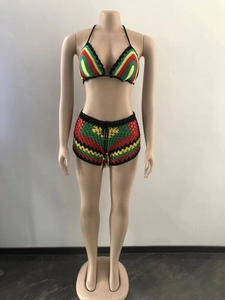 Detail of hand-crocheted Rasta bikini set with red yellow and green striped patterns
