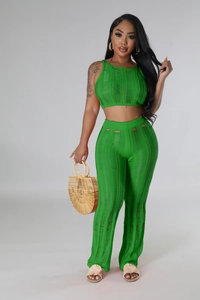 Detail view of vibrant green knit set with unique horizontal distressed cutout textures