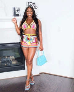 Detail of colorful crochet two-piece set featuring bohemian knit patterns and vibrant hues