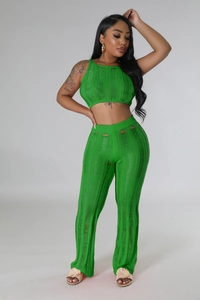 Detail of lime green knit set featuring horizontal cutout textures and distressed design