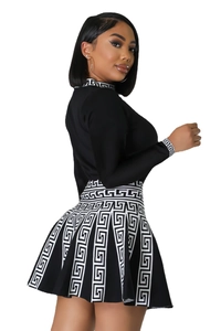 Detail of knitted long sleeve top and mini skirt with Greca Greek key border pattern