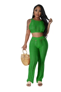 Detailed knit texture of green sleeveless crop top and high waist hollow out trousers set