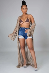 Close-up of khaki crochet knit cardigan with intricate openwork stitch and texture
