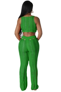 Detail of green knit set featuring vertical laddered cut-outs and mesh texture on the back